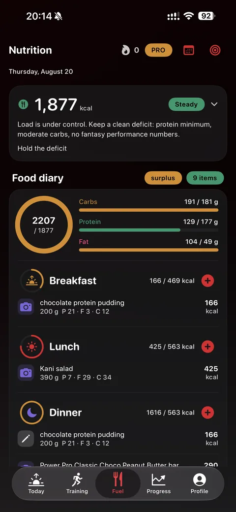The Fuel screen: a calorie ring against the day's target, carbs, protein and fat bars, and the food diary underneath.